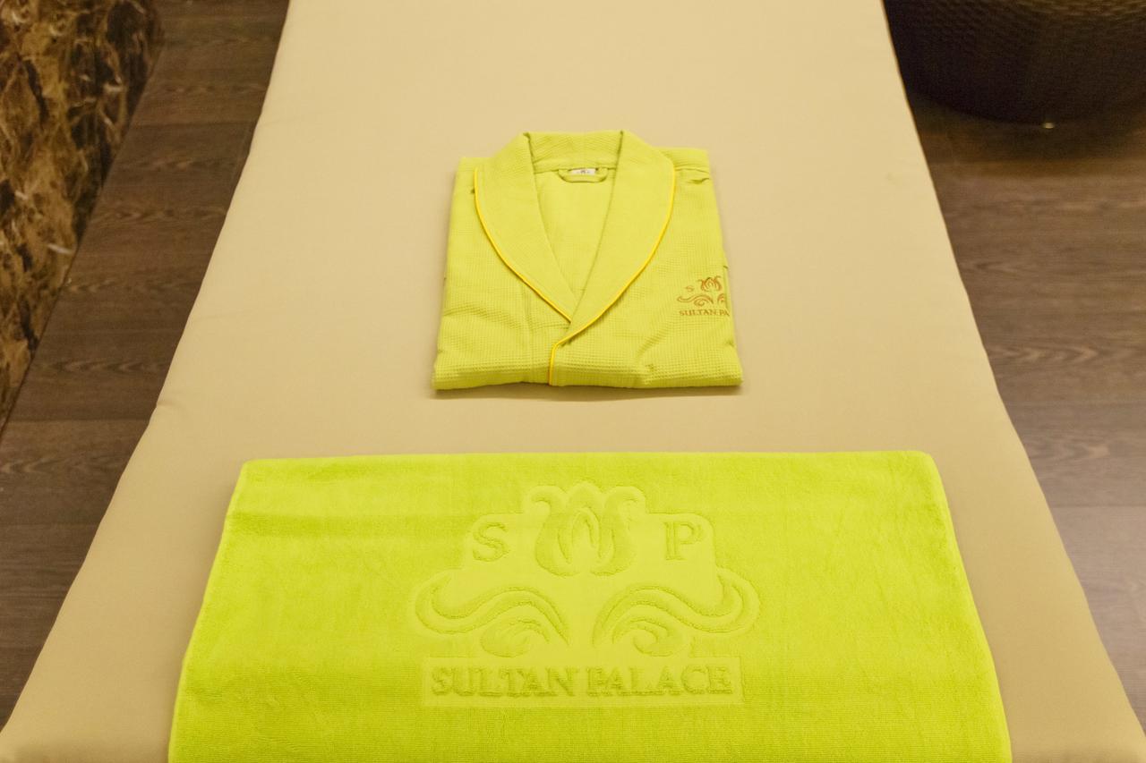 Sultan Palace Hotel Atyraū Extérieur photo A bathrobe and towel